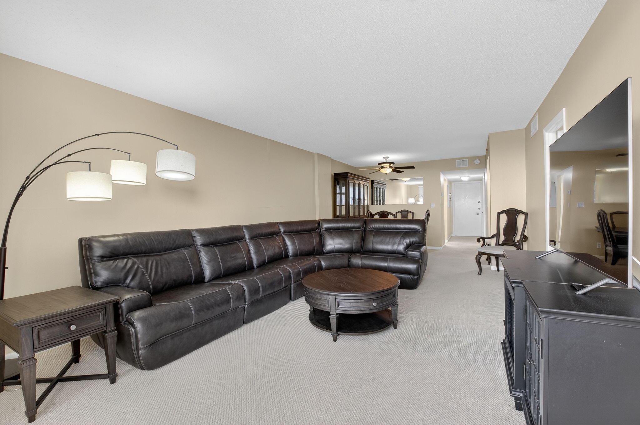 555 Northwest 4th Avenue, Unit 4230 Boca Raton, FL 33432 - Photo 3 of 38 a living room with furniture and a flat screen tv