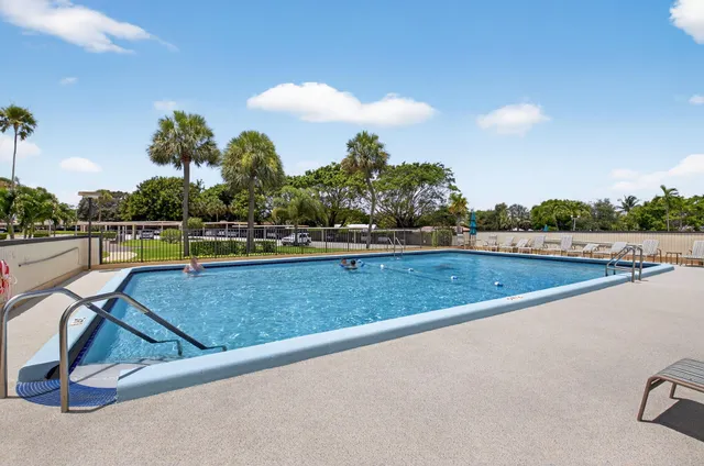 a view of a swimming pool and an outdoor space