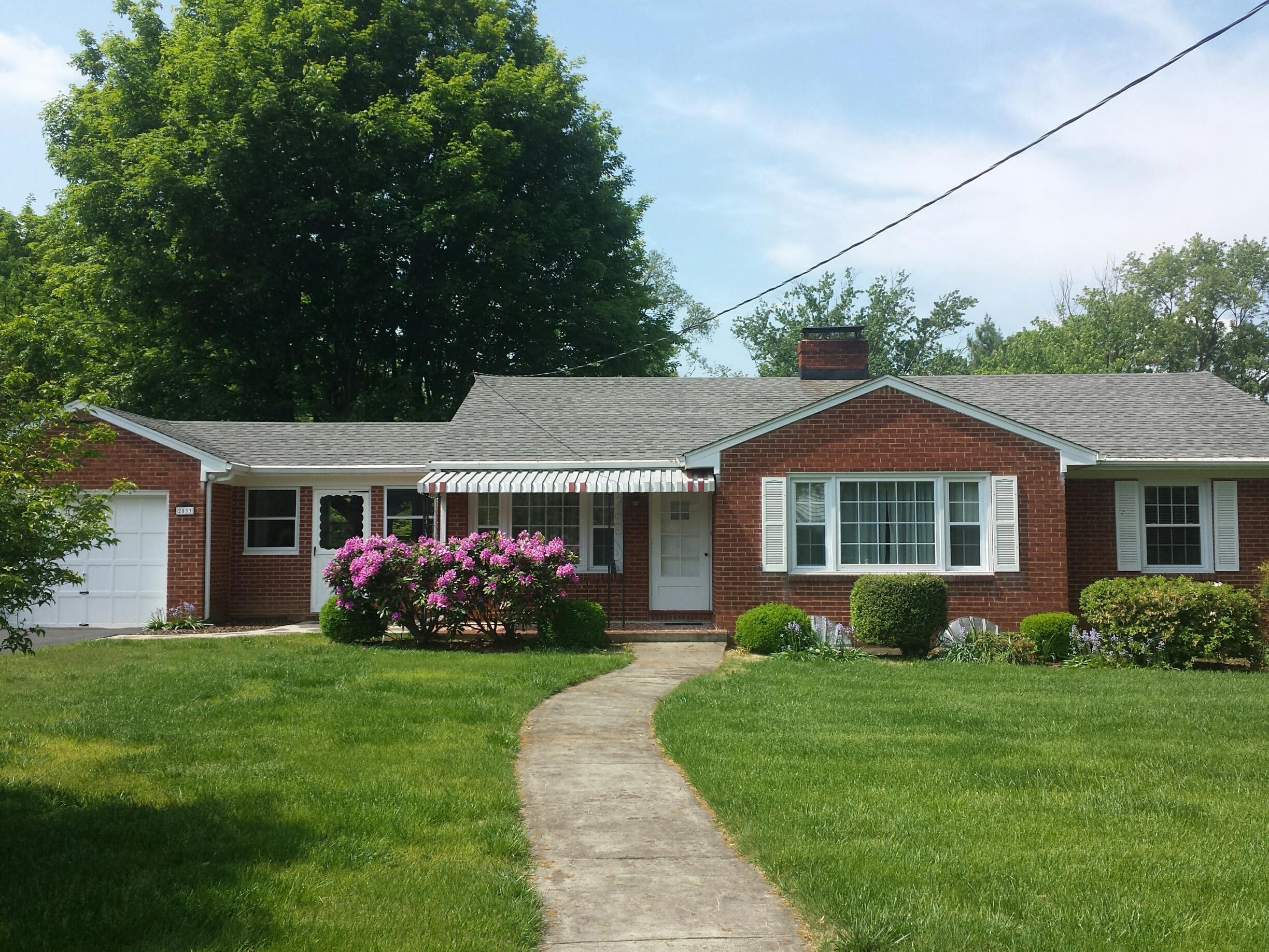 2033 Darlington Road Southwest Roanoke, VA 24018 - Photo 1 of 26 Front of Darlington with flowers