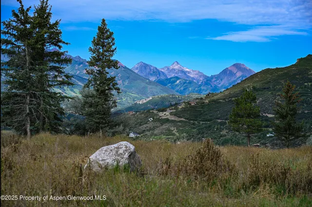 a lake view with a mountain in the background