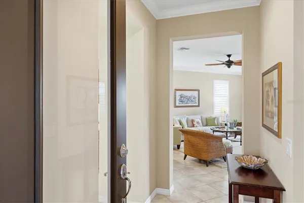 a dining hall with stainless steel appliances granite countertop a dining table and chairs