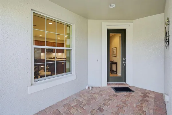 a view of a house with a yard porch and sitting area