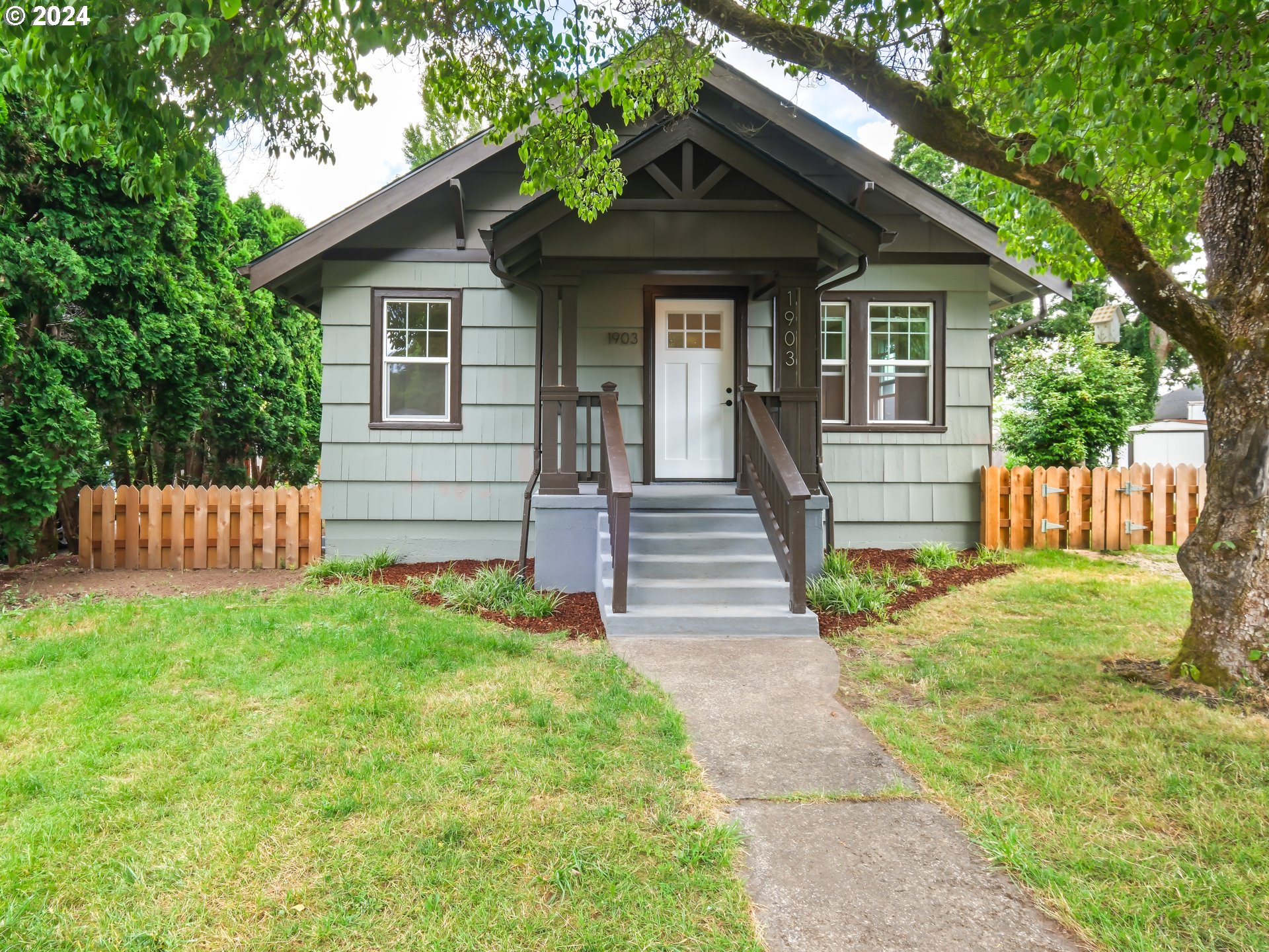 1903 14th Street Oregon City, OR 97045 - Photo 1 of 34 a front view of a house with a yard