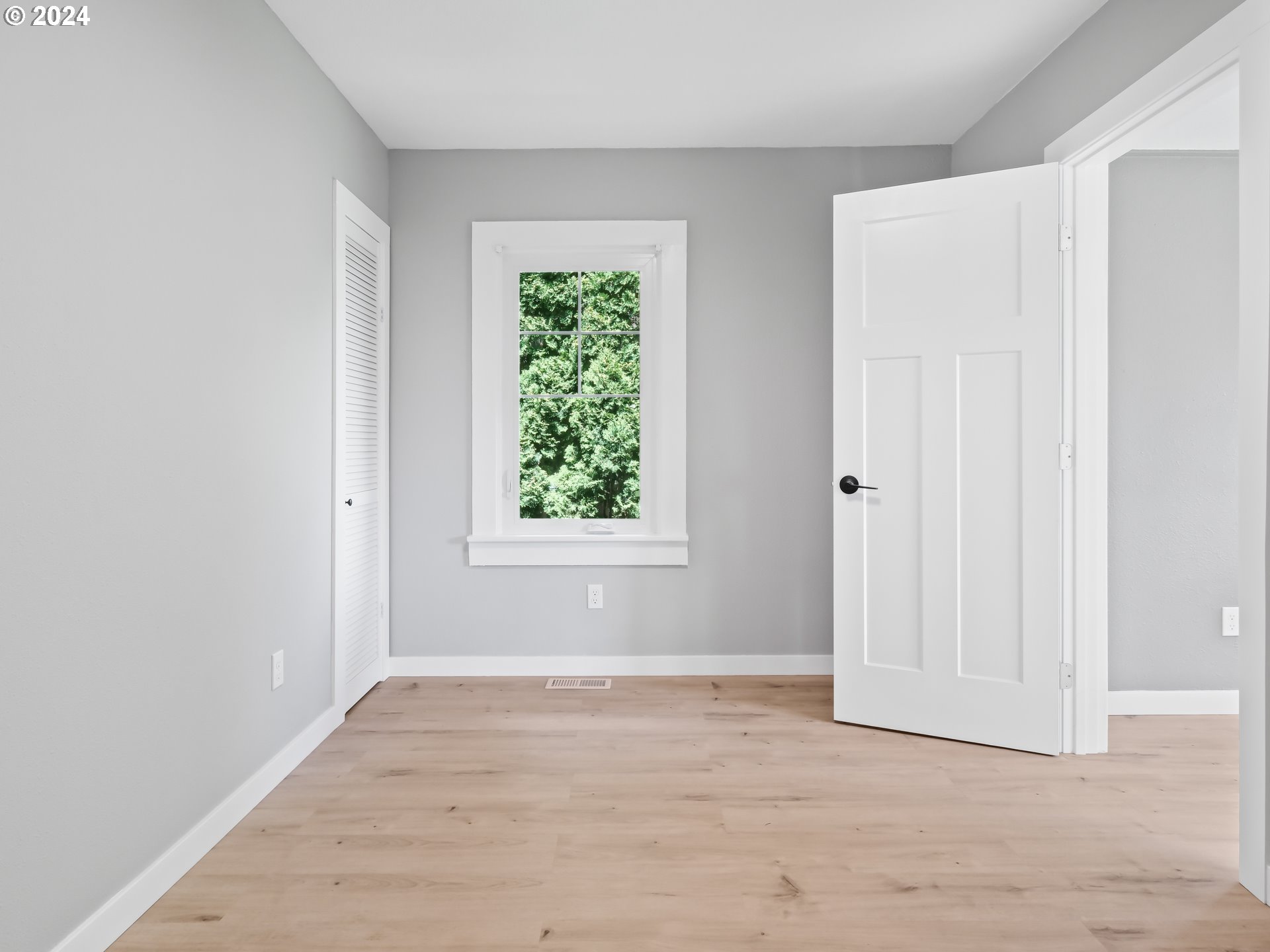 1903 14th Street Oregon City, OR 97045 - Photo 17 of 34 an empty room with wooden floor and windows