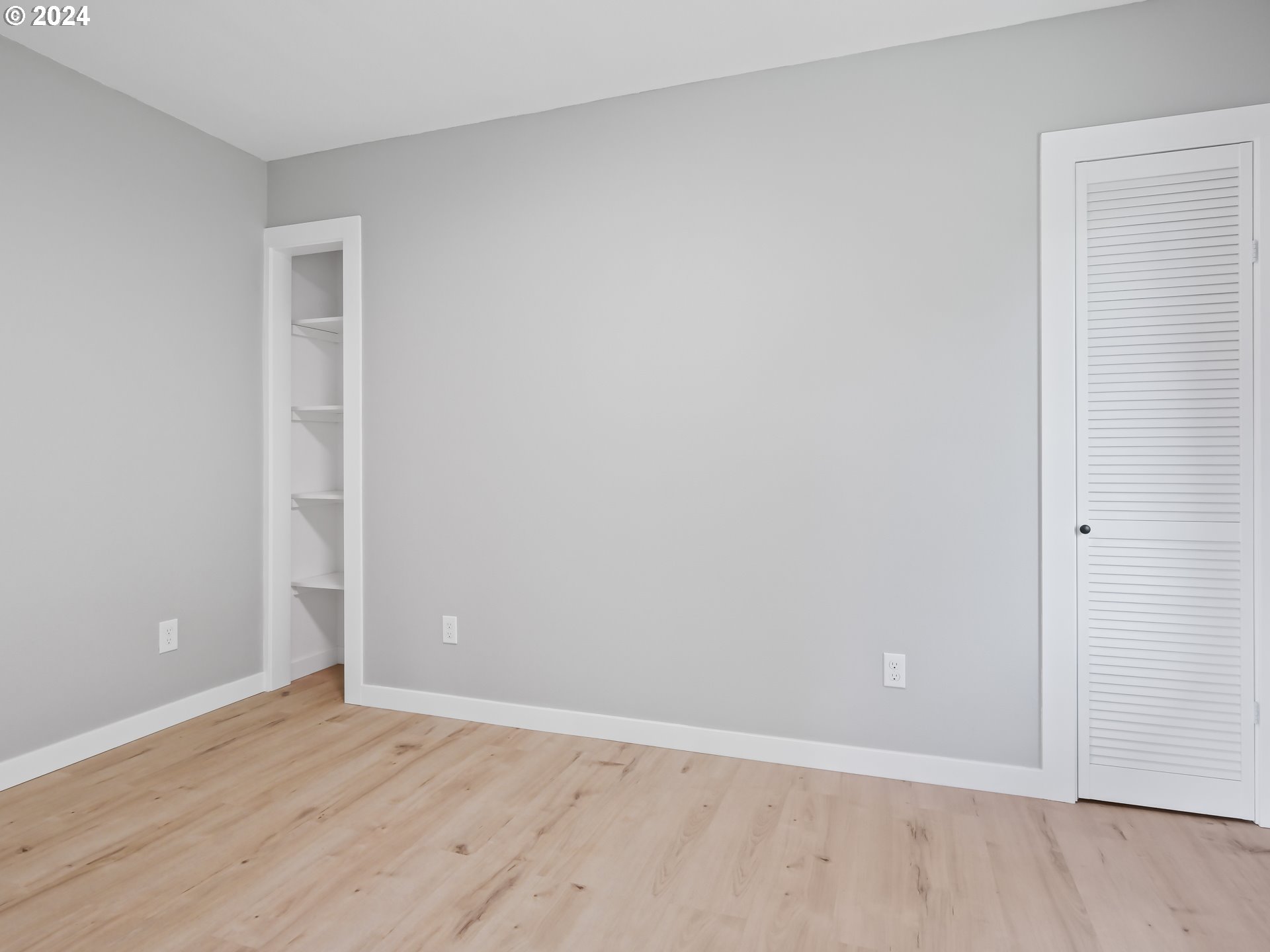 1903 14th Street Oregon City, OR 97045 - Photo 18 of 34 a view of an empty room with wooden floor and closet