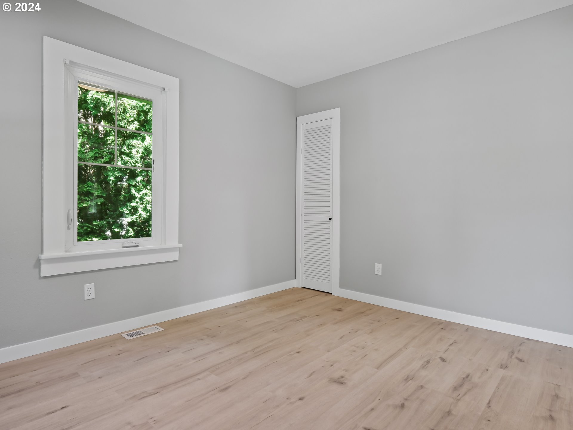 1903 14th Street Oregon City, OR 97045 - Photo 20 of 34 an empty room with wooden floor and windows