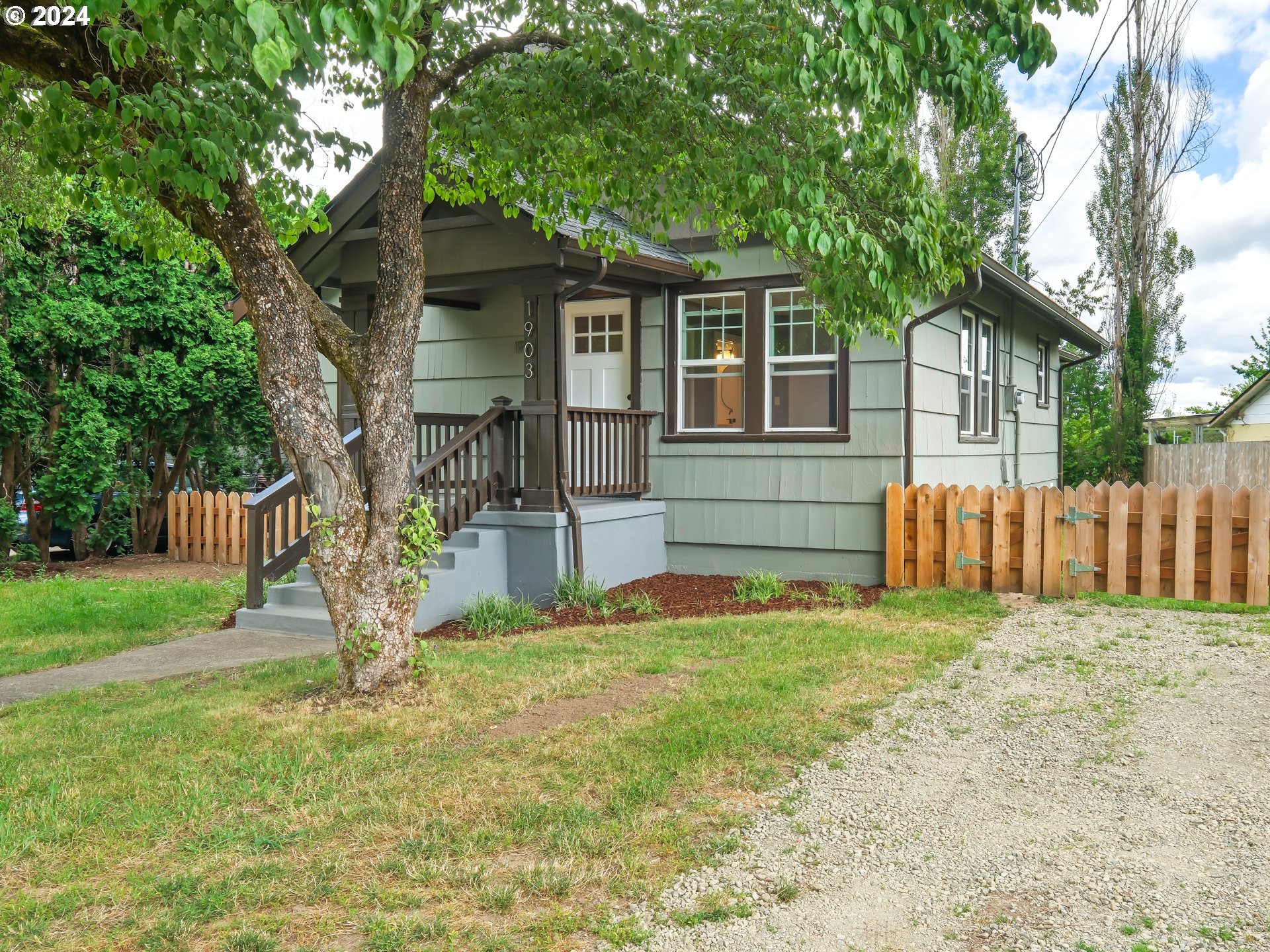 1903 14th Street Oregon City, OR 97045 - Photo 2 of 34 a front view of a house with a yard