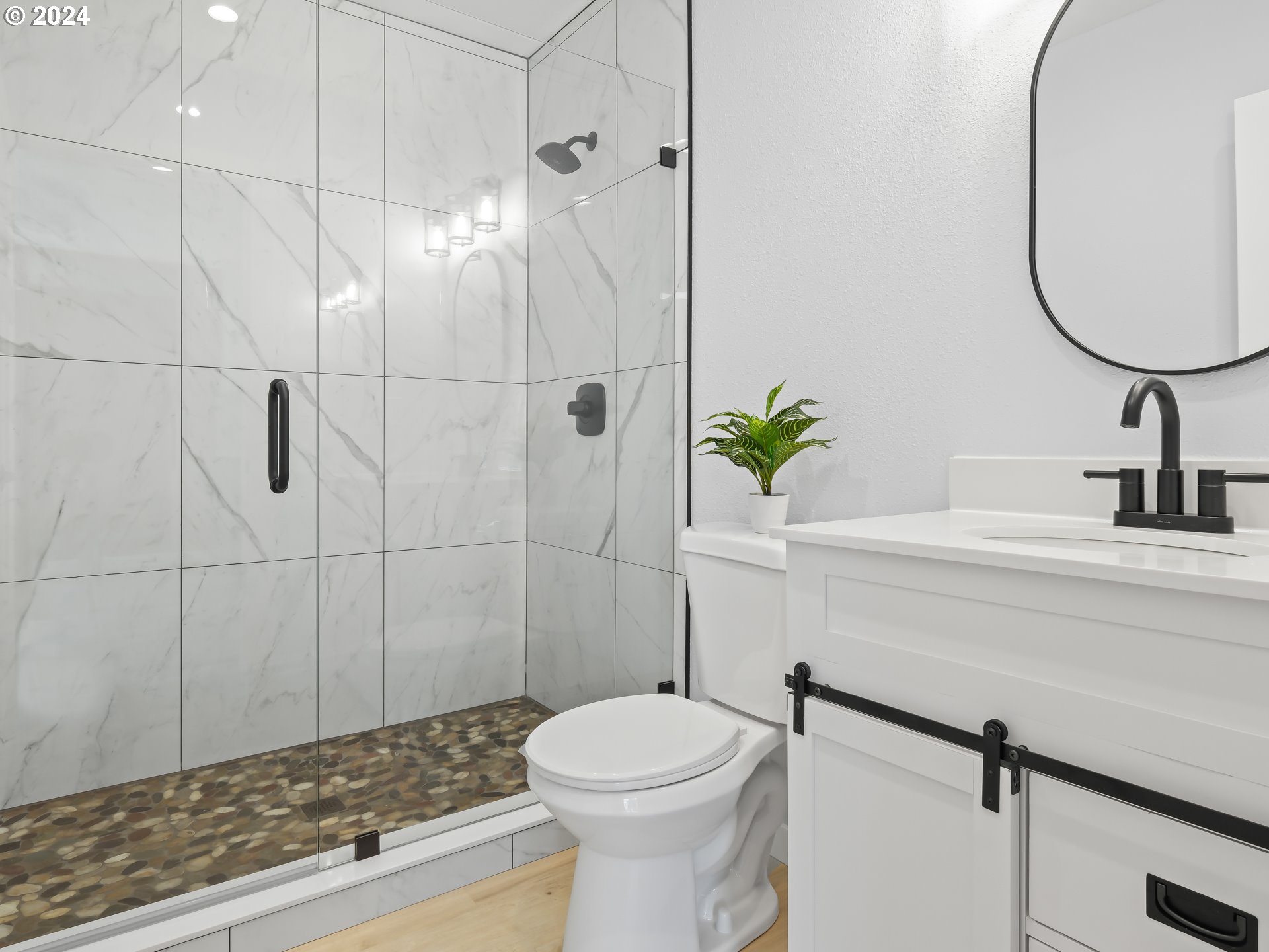 1903 14th Street Oregon City, OR 97045 - Photo 21 of 34 a bathroom with a sink a toilet and shower