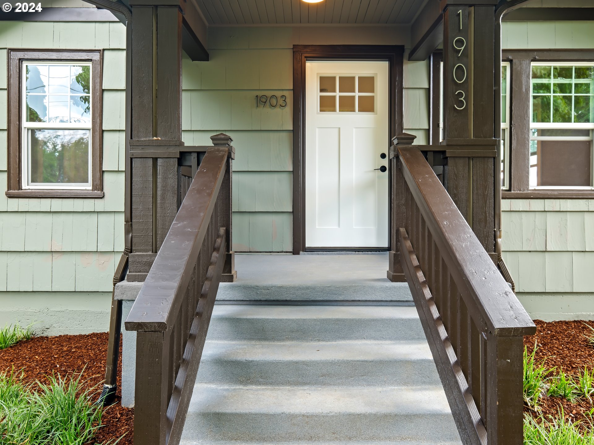 1903 14th Street Oregon City, OR 97045 - Photo 3 of 34 a view of staircase with lots of frames on wall and windows