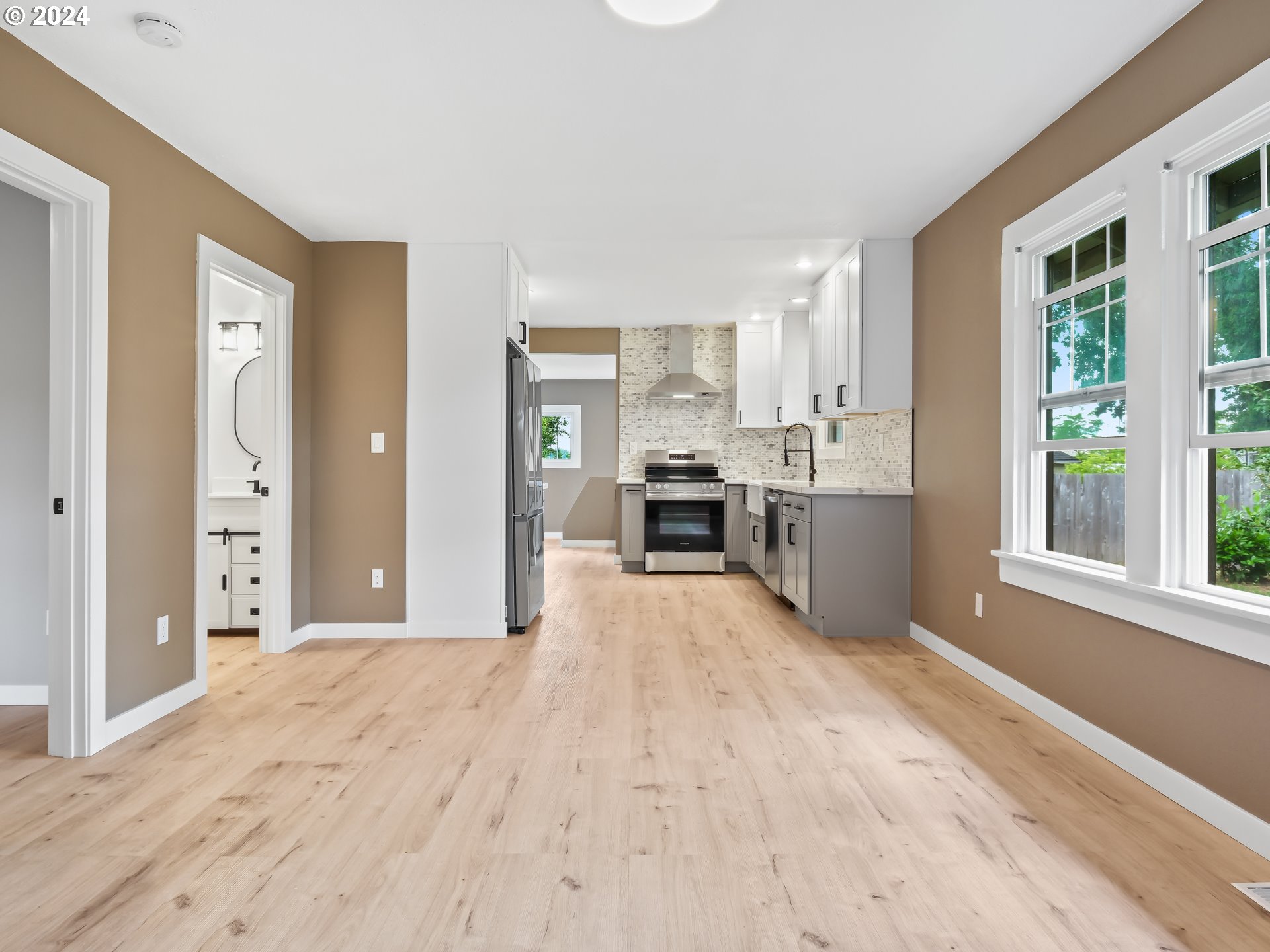 1903 14th Street Oregon City, OR 97045 - Photo 5 of 34 a large room with windows and view of kitchen