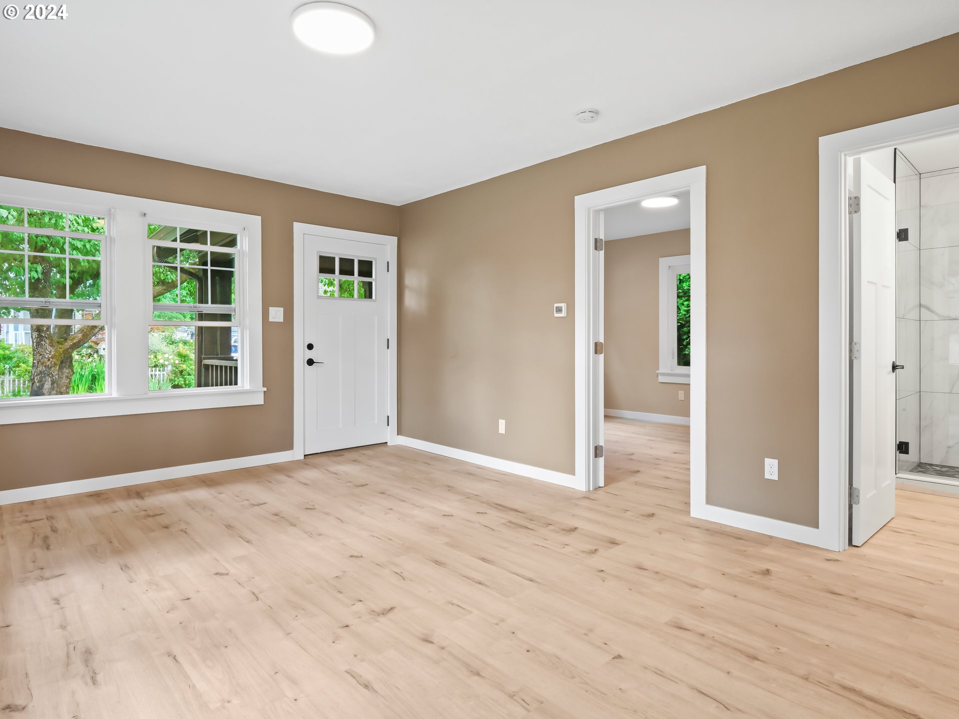1903 14th Street Oregon City, OR 97045 - Photo 7 of 34 an empty room with wooden floor and windows