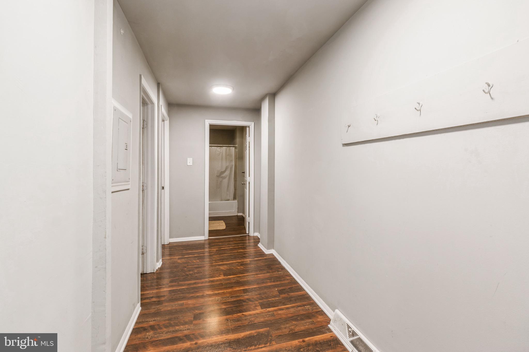 525-527 Penn Street, Unit 1A Camden, NJ 08102 - Photo 7 of 12 a view of a hallway with wooden floor