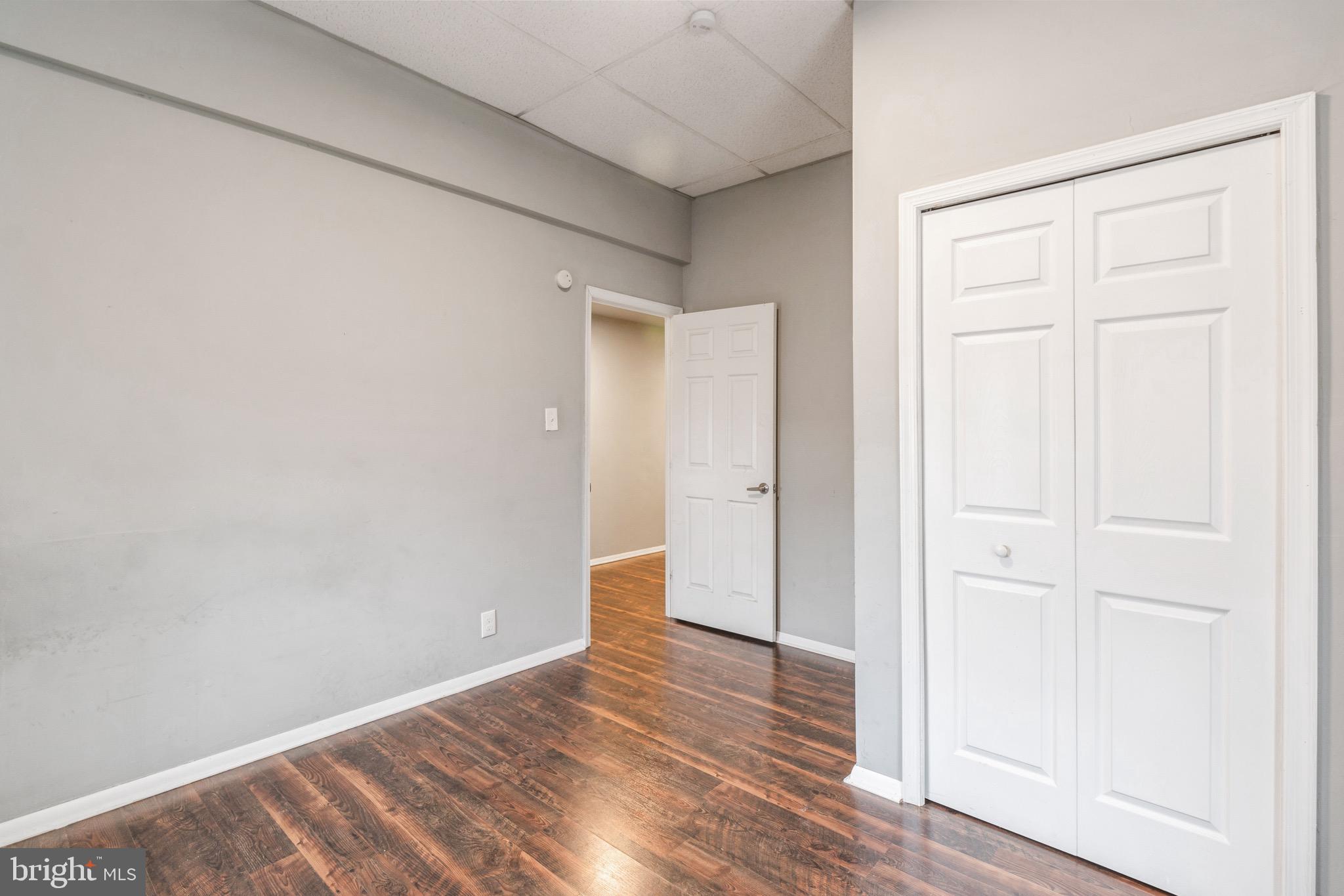 525-527 Penn Street, Unit 1A Camden, NJ 08102 - Photo 10 of 12 an empty room with wooden floor
