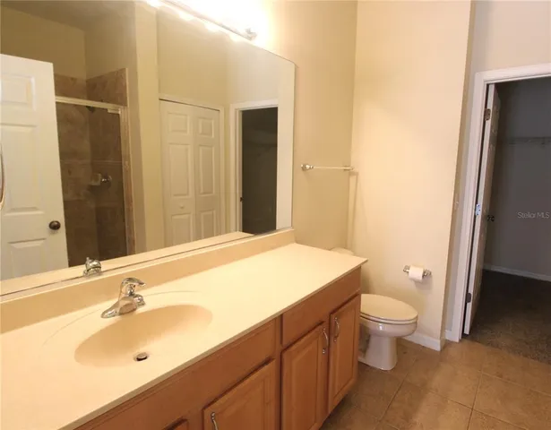 a bathroom with a sink and a large mirror