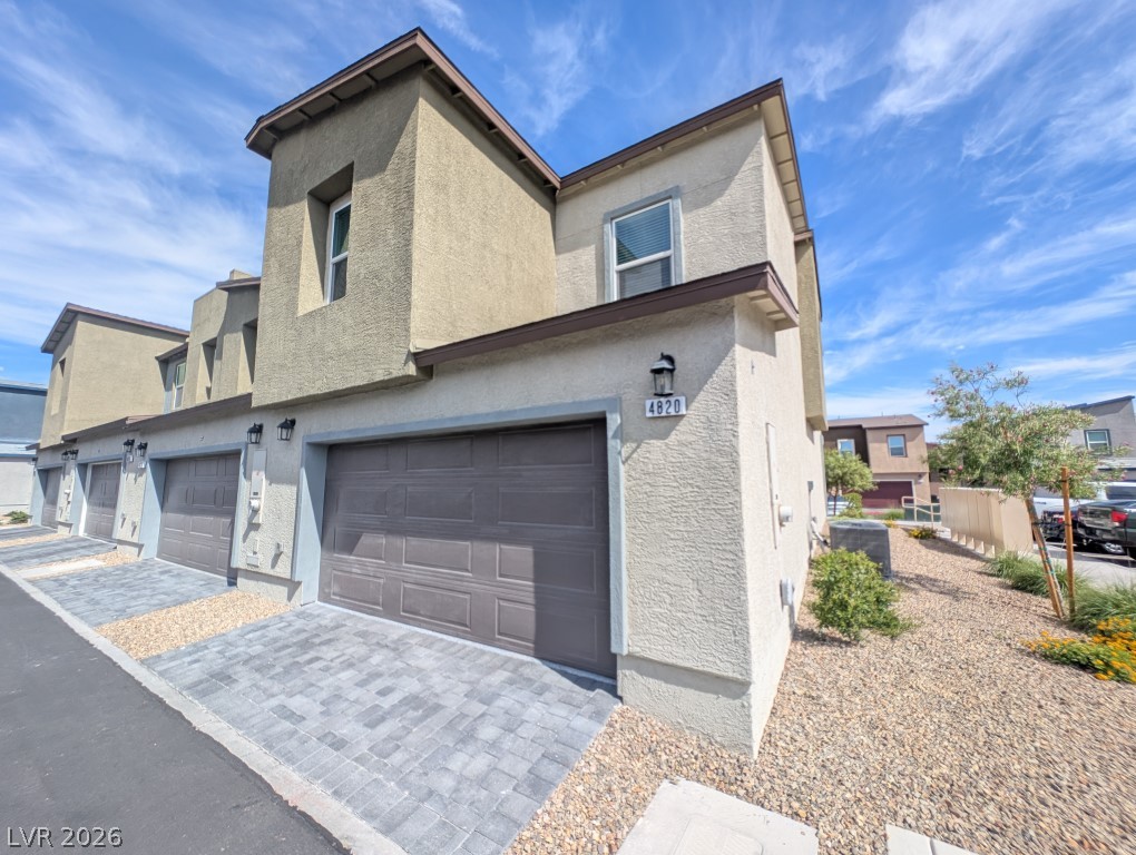 4820 Orchid Rdg Avenue Las Vegas, NV 89141 - Photo 1 of 16 A striking contemporary exterior with multi-story stucco construction and integrated garage bays welcomes you home.