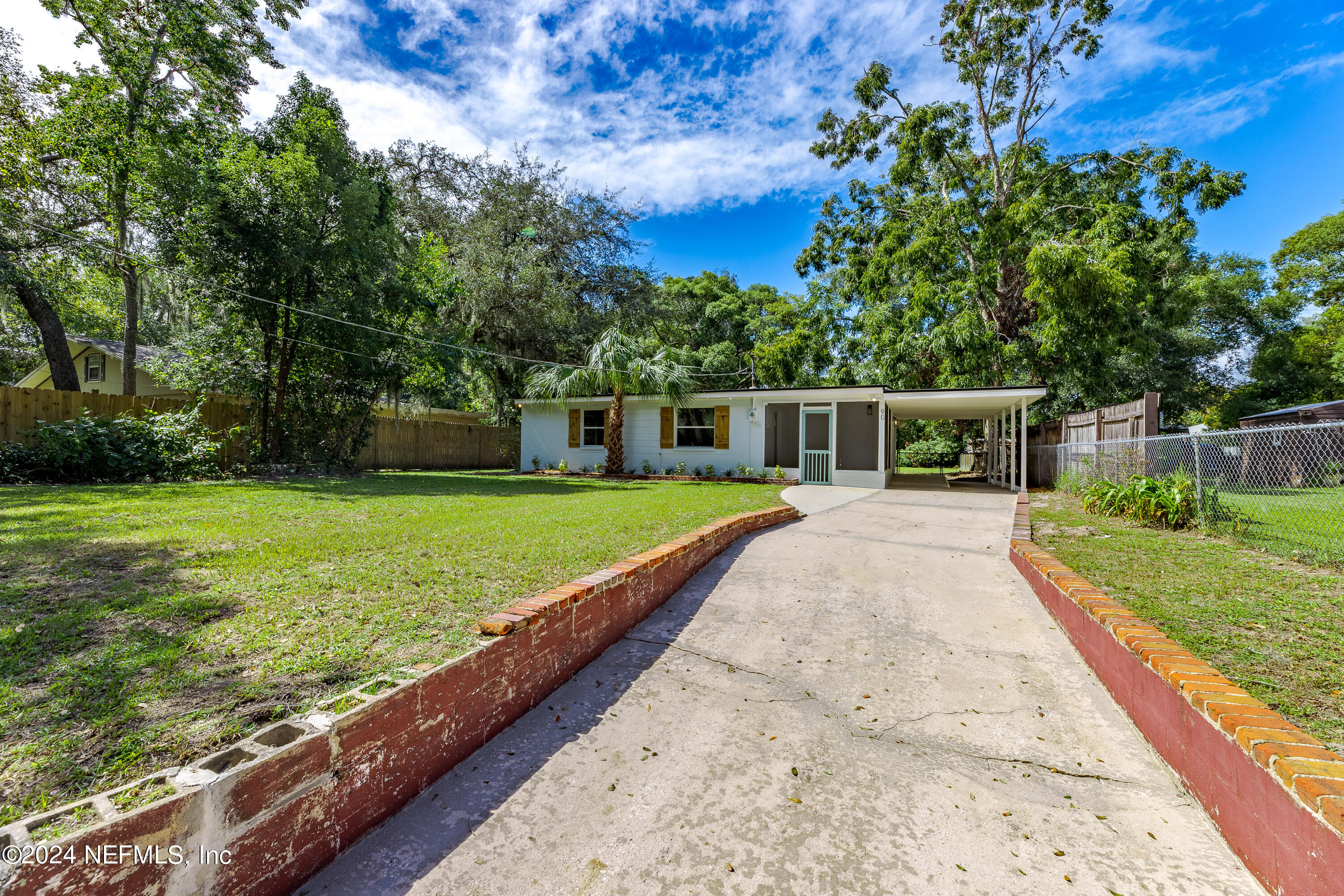 90 Spring Street St. Augustine, FL 32084 - Photo 3 of 24 a view of house with swimming pool and yard