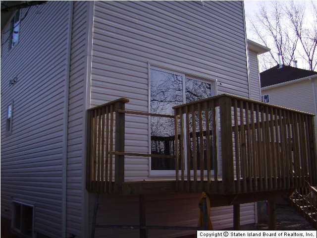 291 Rudyard Street Staten Island, NY 10306 - Photo 2 of 5 a view of a house with a street