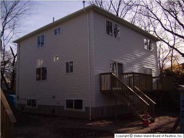 291 Rudyard Street Staten Island, NY 10306 - Photo 4 of 5 a front view of a house with a yard
