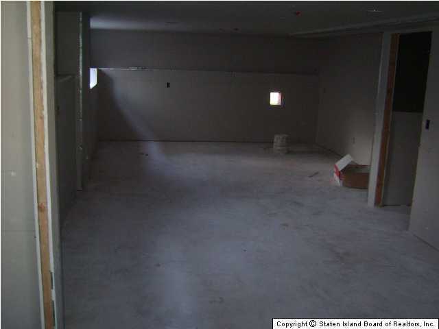 291 Rudyard Street Staten Island, NY 10306 - Photo 5 of 5 a view of a room with an empty space