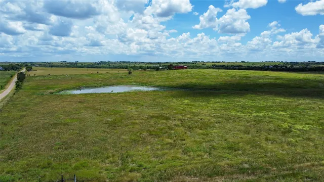 a view of a golf course with a lake