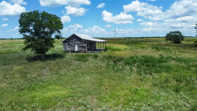 a view of a garden with a house