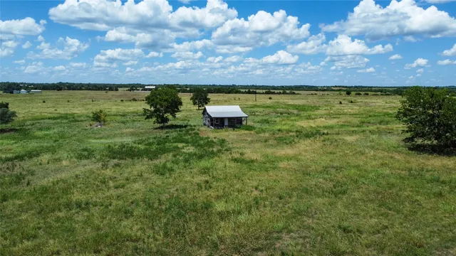 a view of a lake with sunset