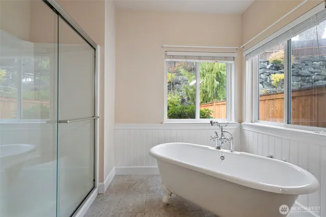 a white bath tub sitting next to a white sink