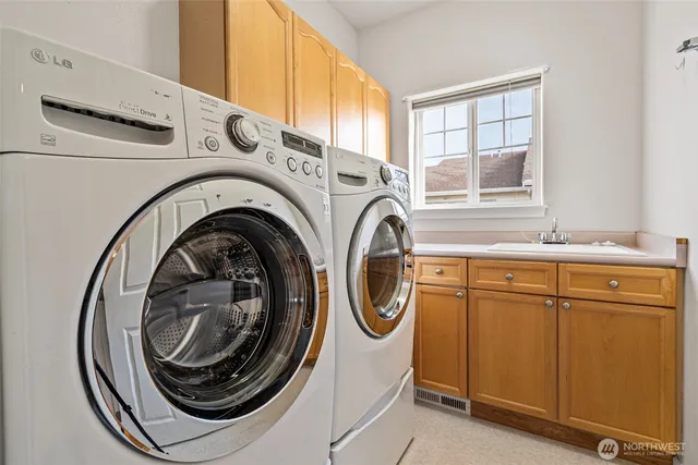 a utility room with dryer and washer