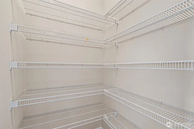 a view of a room with white walls