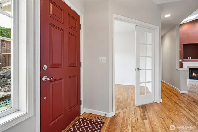 a view of entryway with wooden floor