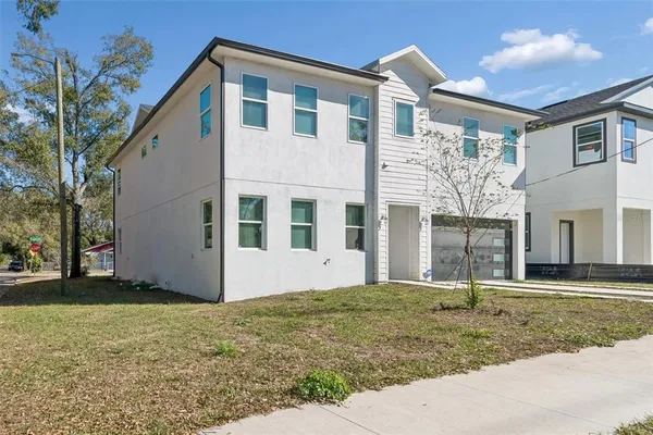 a front view of a house with a yard