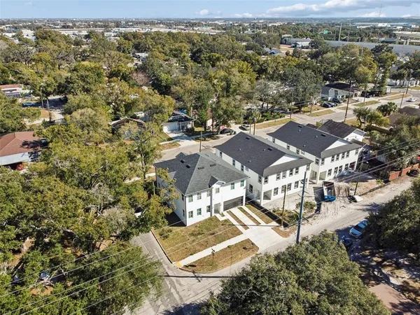 an aerial view of residential houses with outdoor space