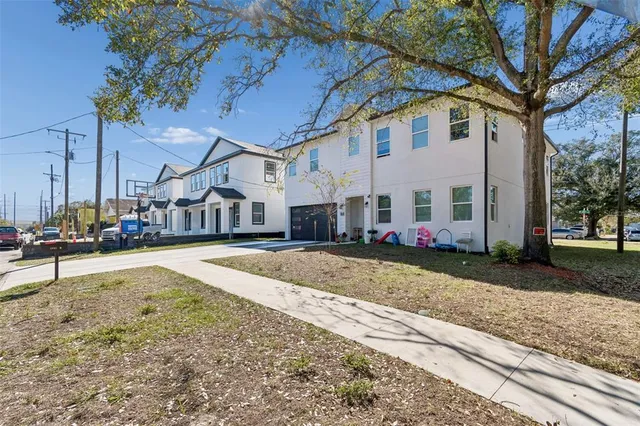 a view of a backyard with sitting area