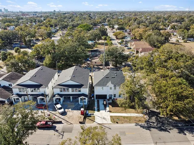an aerial view of residential houses and street