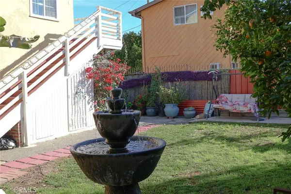 a view of a backyard with sitting area