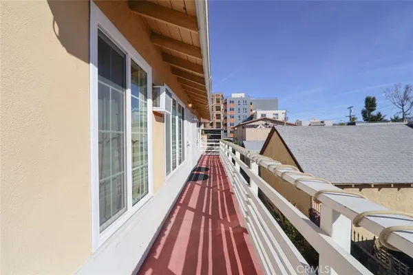a view of a balcony with wooden floor and staircase