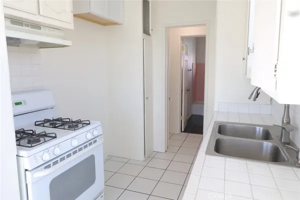 a kitchen with a stove and a cabinet