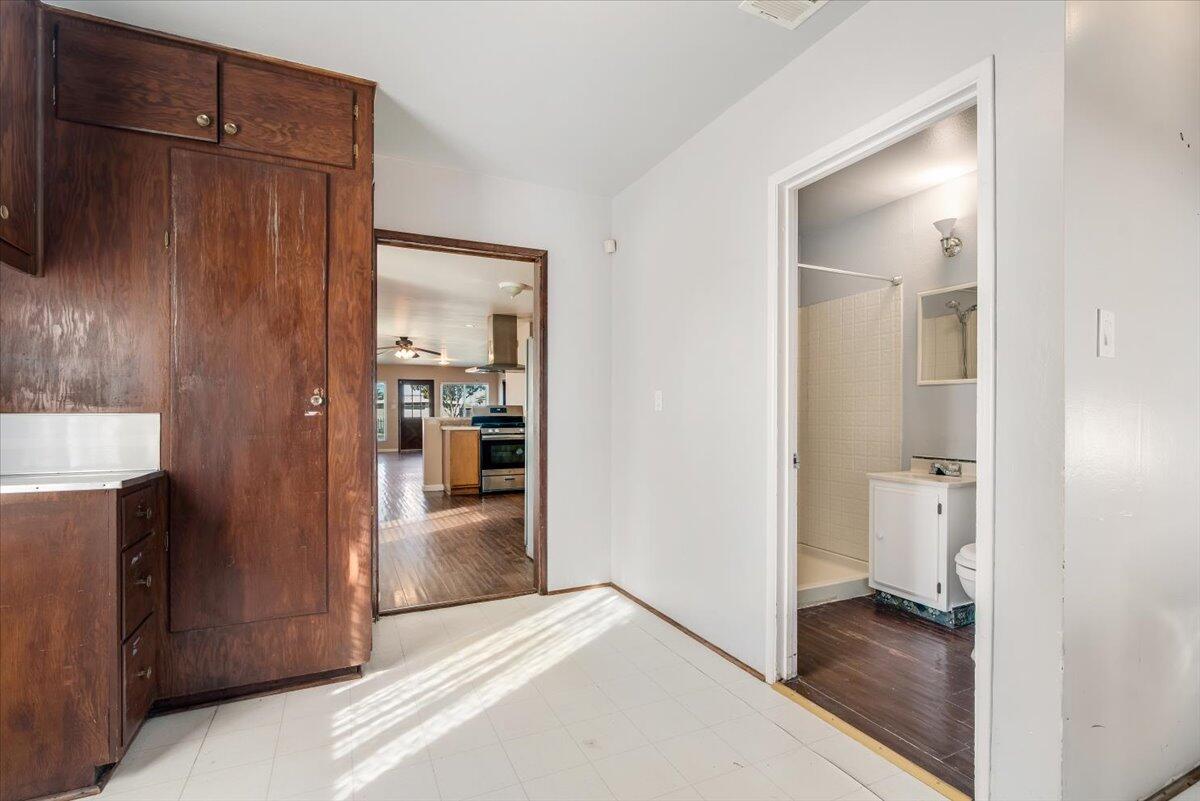 230 North D Street Lompoc, CA 93436 - Photo 12 of 29 a view of a kitchen from the hallway with a bathroom and a bathroom