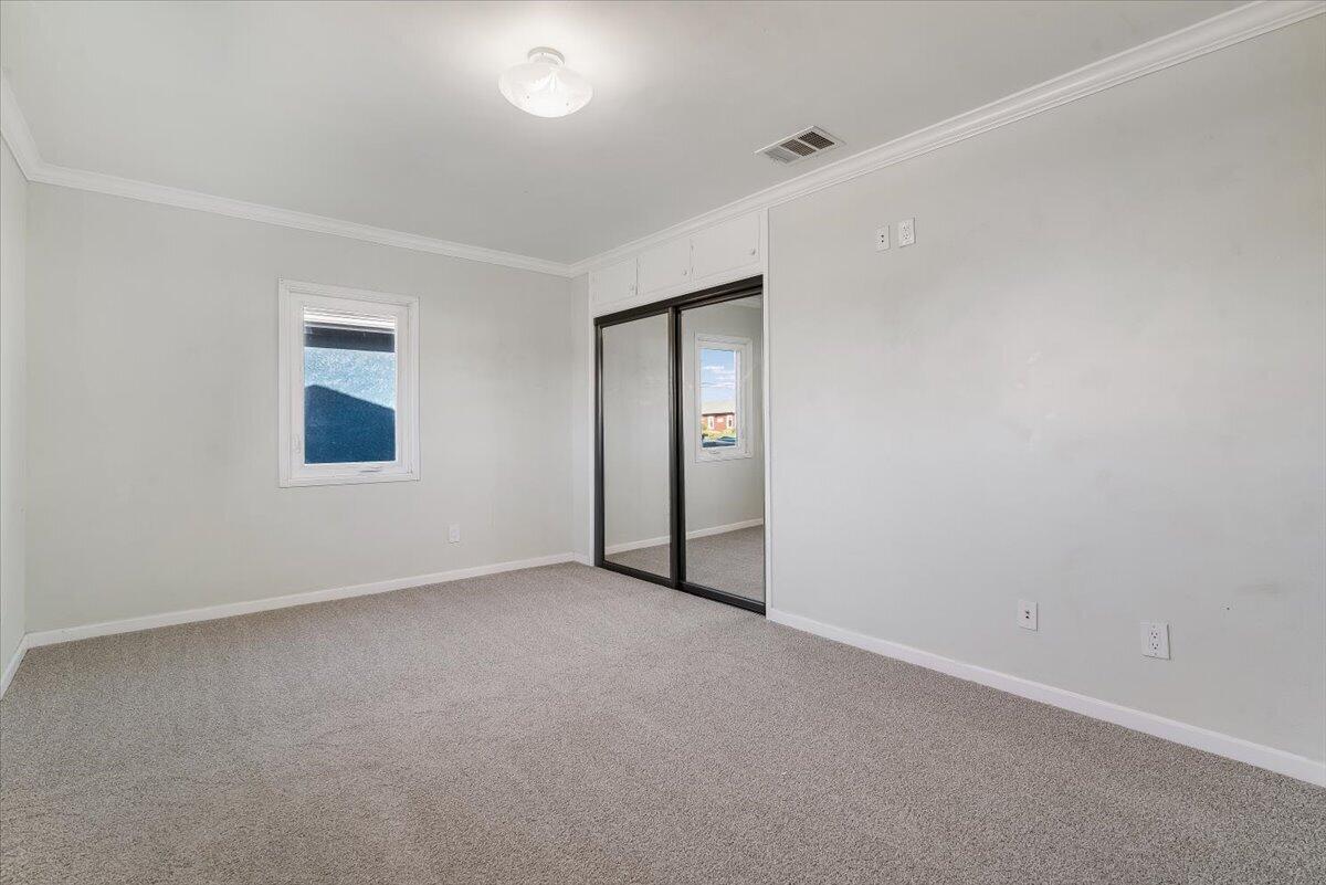 230 North D Street Lompoc, CA 93436 - Photo 14 of 29 an empty room with windows and closet