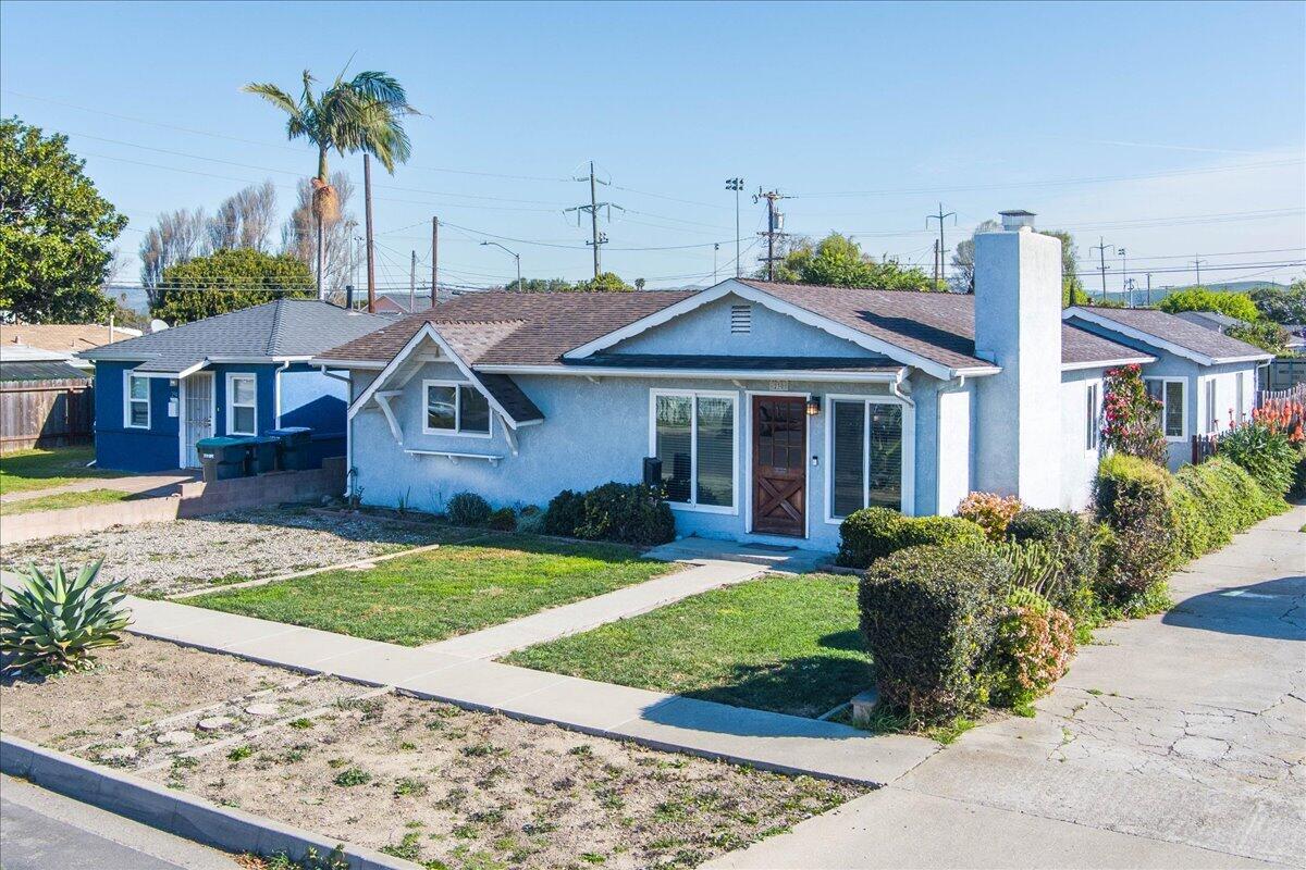 230 North D Street Lompoc, CA 93436 - Photo 2 of 29 a front view of a house with garden