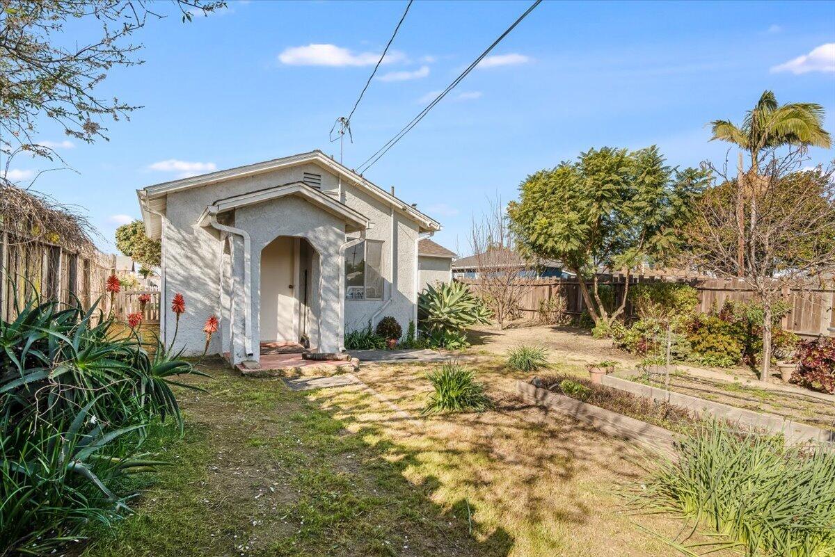 230 North D Street Lompoc, CA 93436 - Photo 21 of 29 a front view of a house with a yard