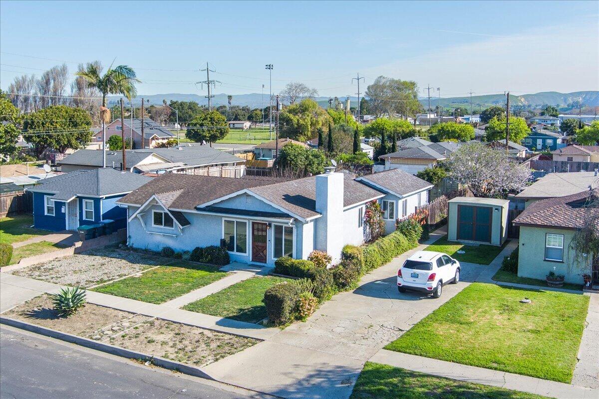 230 North D Street Lompoc, CA 93436 - Photo 25 of 29 a front view of a house with garden