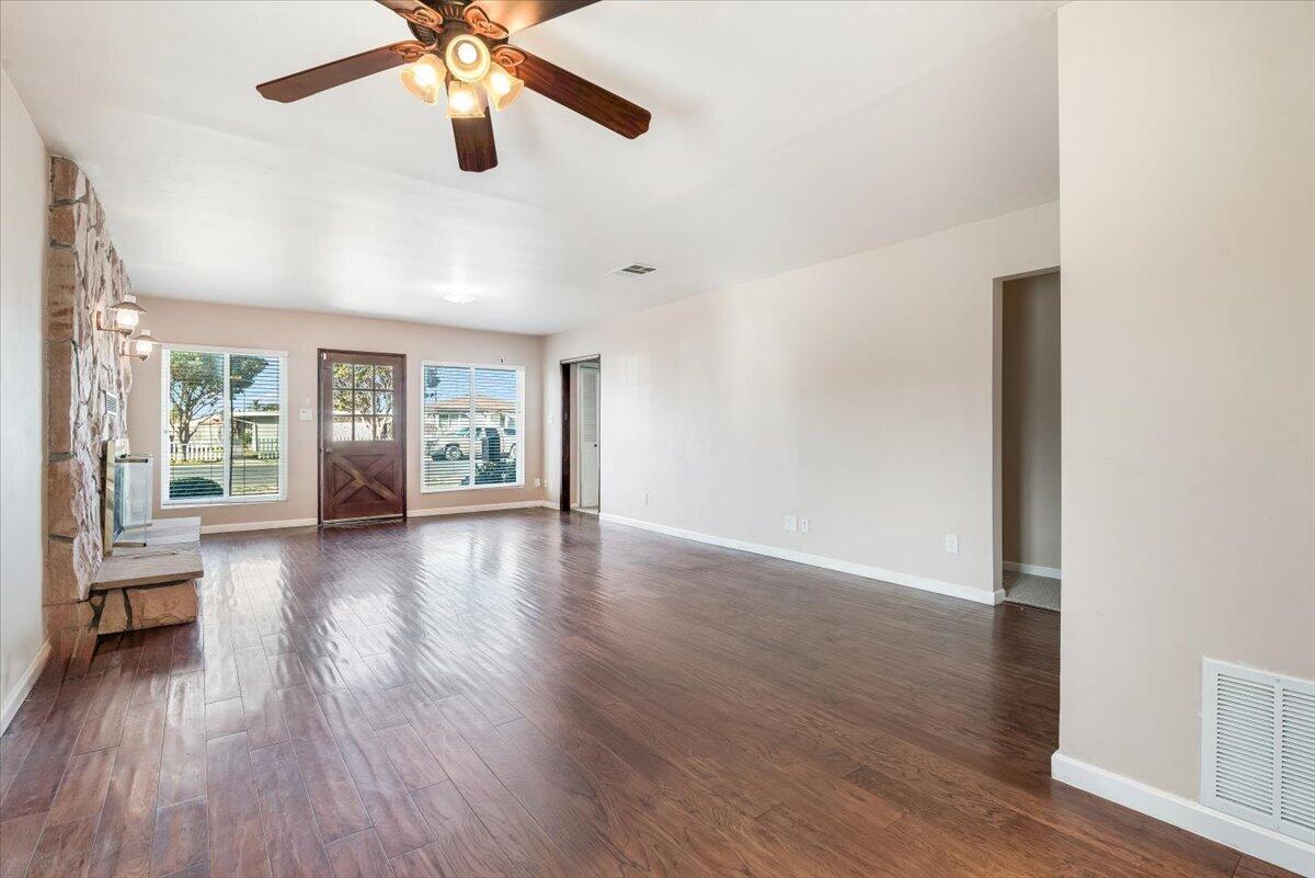230 North D Street Lompoc, CA 93436 - Photo 5 of 29 a view of an empty room with wooden floor and a window