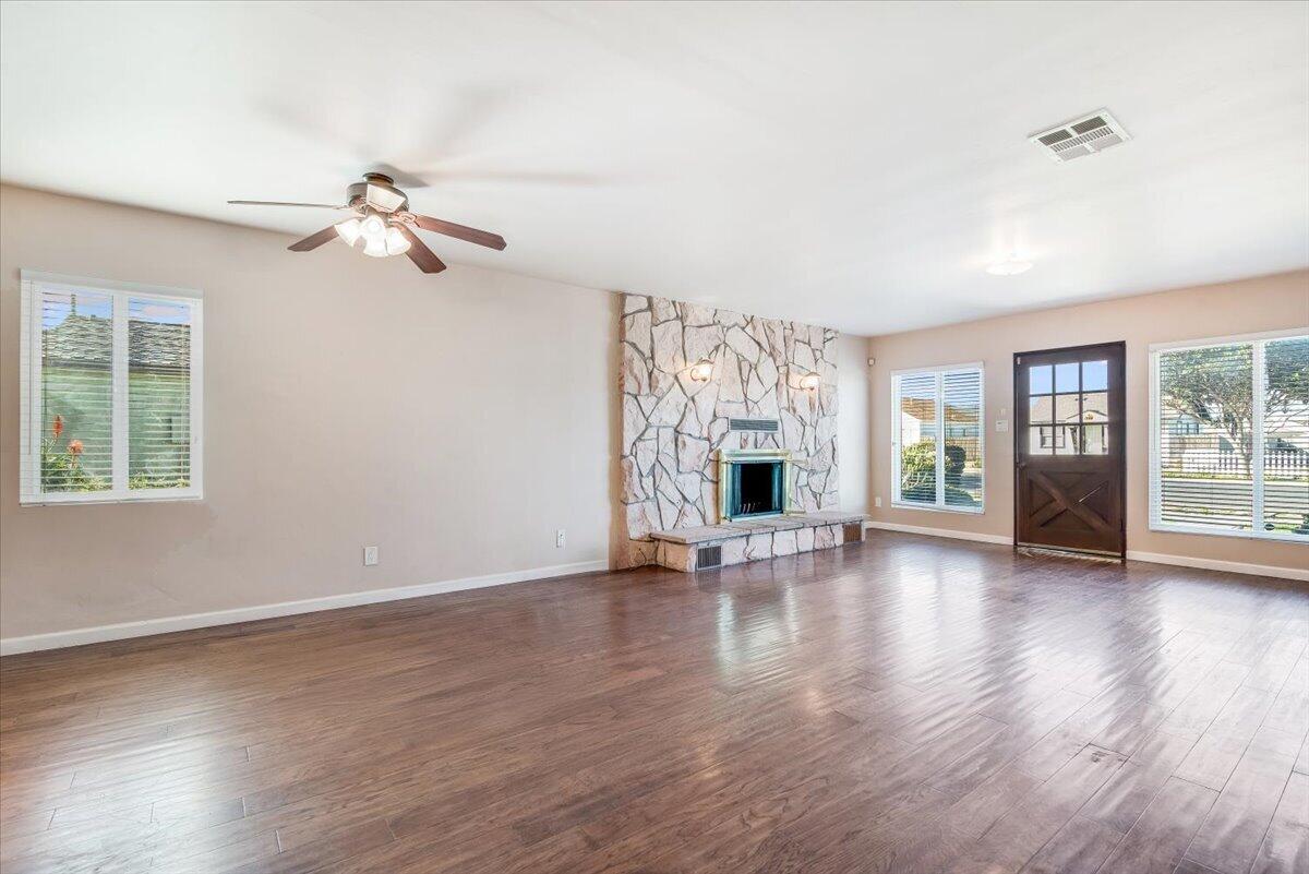 230 North D Street Lompoc, CA 93436 - Photo 6 of 29 a view of an empty room with window and wooden floor