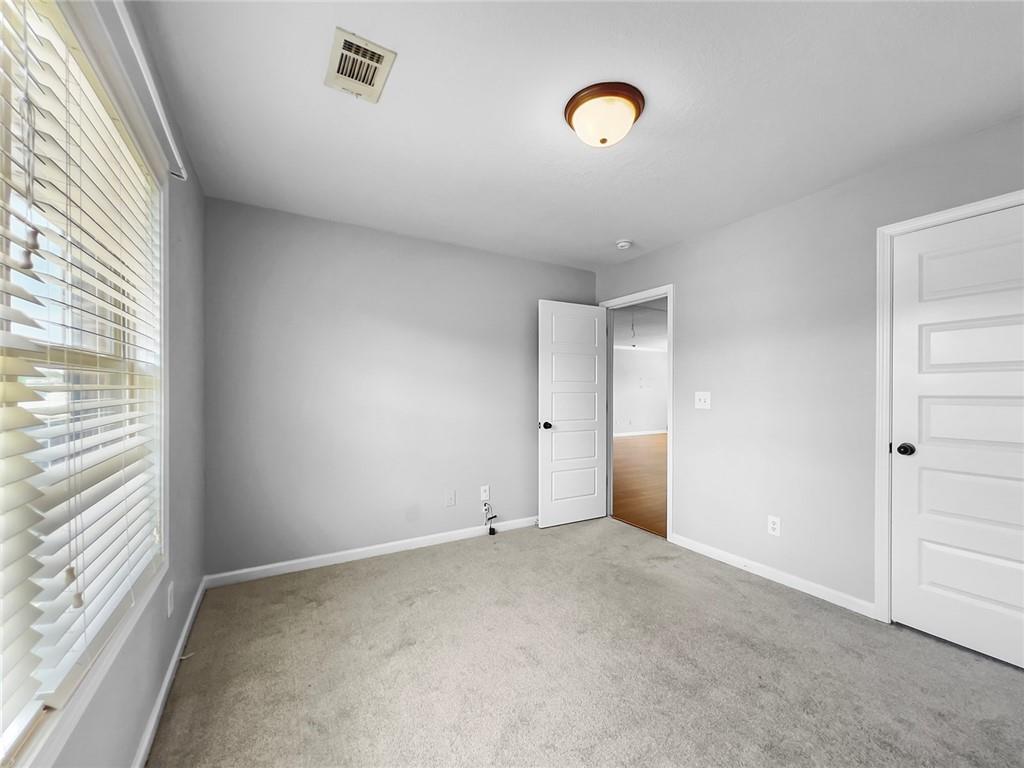 6 Pebblebrook Lane Fort Mitchell, AL 36856 - Photo 25 of 48 Unfurnished bedroom featuring carpet floors and baseboards