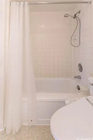 a bathroom with a shower and a bathtub