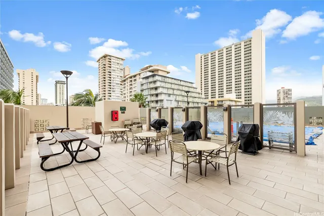 a view of living room with patio furniture and kitchen view
