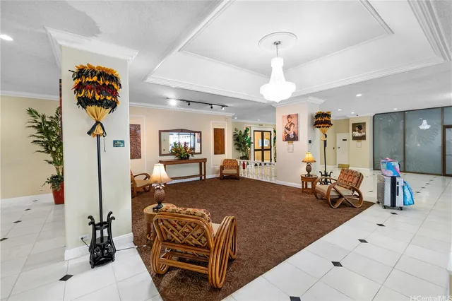 a living room with furniture and a chandelier