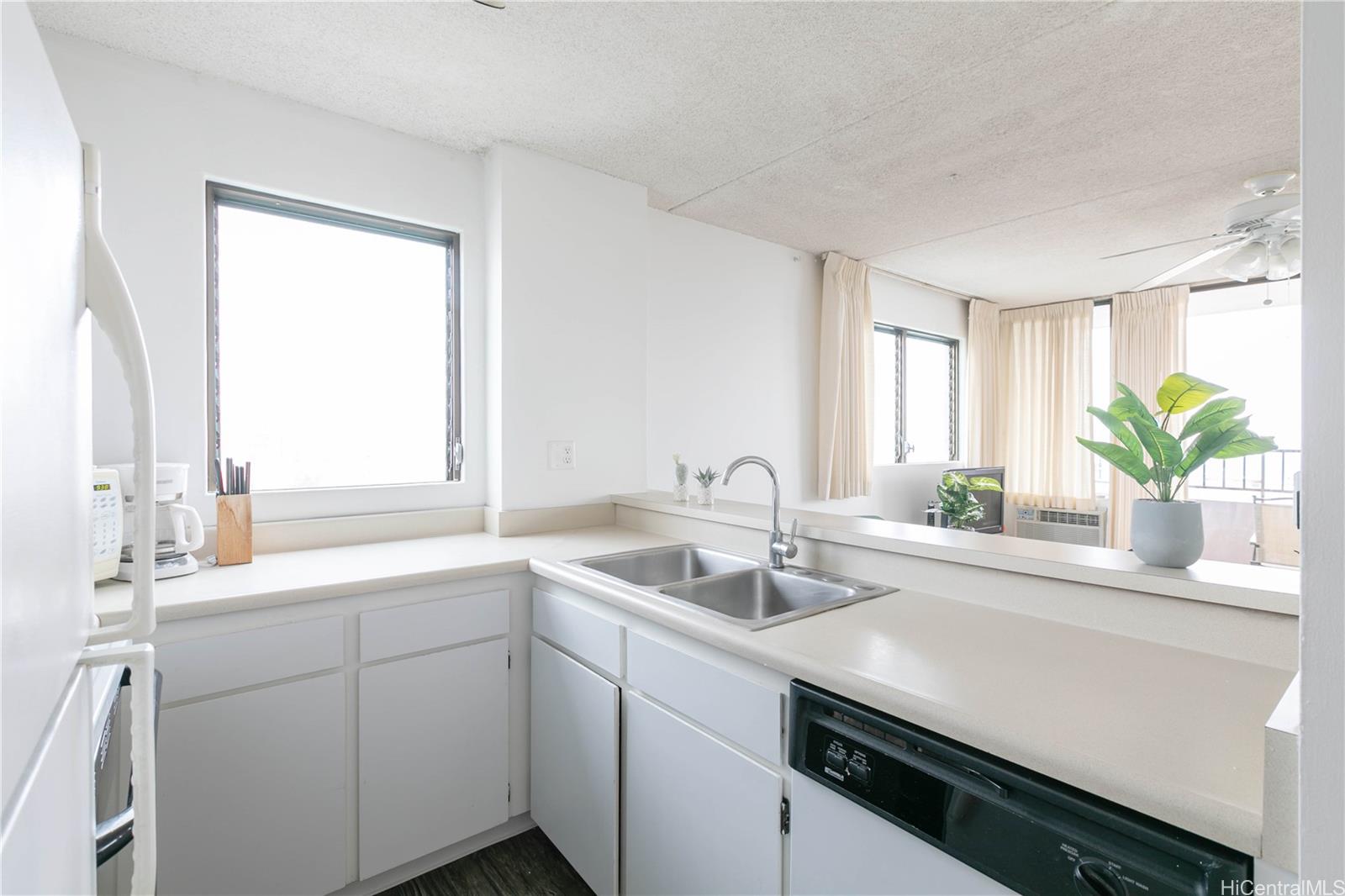 2240 Kūhiō Avenue, Unit 2608 Honolulu, HI 96815 - Photo 9 of 25 a kitchen with sink and window