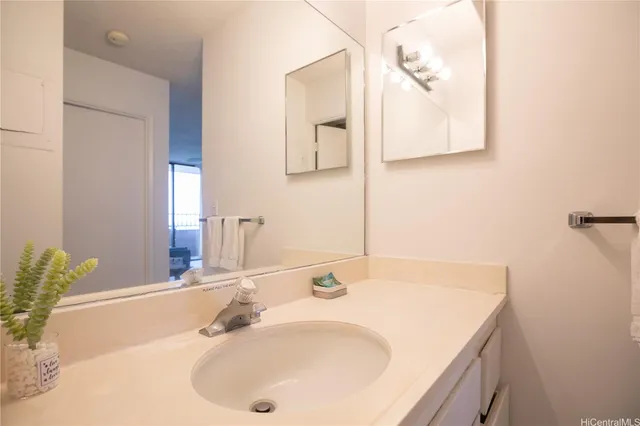 a bathroom with a sink and a mirror
